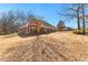 Spacious backyard featuring lush trees and lawn space, providing plenty of room for outdoor activities and landscaping at 1585 Lake Dow Rd, Mcdonough, GA 30252