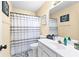 Well-lit bathroom with a shower, vanity, and decorative mirror at 1585 Lake Dow Rd, Mcdonough, GA 30252