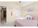 Bright bedroom featuring a pink bedspread, vaulted ceiling, and closet at 1585 Lake Dow Rd, Mcdonough, GA 30252
