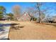 View of home exterior, with a basketball hoop and driveway at 1585 Lake Dow Rd, Mcdonough, GA 30252
