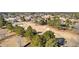Aerial view of a golf course with sand traps surrounded by tall trees and residential homes in the background at 1585 Lake Dow Rd, Mcdonough, GA 30252