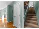 Hallway with hardwood floors, staircase, and closet at 1585 Lake Dow Rd, Mcdonough, GA 30252