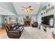 Inviting living room features a fireplace, TV, and plush seating, perfect for relaxing and entertaining guests at 1585 Lake Dow Rd, Mcdonough, GA 30252