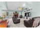 Bright living room boasts a vaulted ceiling, fireplace, modern decor, and comfortable seating, creating a welcoming space at 1585 Lake Dow Rd, Mcdonough, GA 30252