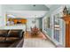 Cozy living area features a dining table, kitchen with wooden cabinets, and a sitting area, perfect for everyday living at 1585 Lake Dow Rd, Mcdonough, GA 30252
