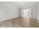 Spacious bedroom has hardwood flooring and high ceilings leading to Primary bath at 1931 Abinger Way, Lawrenceville, GA 30043