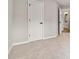 Carpeted bedroom showcasing a doorway to the ensuite bathroom at 1931 Abinger Way, Lawrenceville, GA 30043