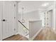 Upstairs hallway has hardwood floors and leads to all bedrooms at 1931 Abinger Way, Lawrenceville, GA 30043