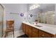 Bathroom featuring a long vanity with a large mirror and a glass enclosed shower at 604 Clearwater Ct, Mcdonough, GA 30252