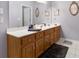 Bathroom features a long vanity with a large mirror and a wooden cabinet with white countertops at 604 Clearwater Ct, Mcdonough, GA 30252