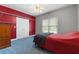 Bedroom featuring a window with shelves and a door beside a bed at 604 Clearwater Ct, Mcdonough, GA 30252