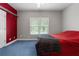 Bedroom featuring a window with shelves and a door beside a bed at 604 Clearwater Ct, Mcdonough, GA 30252