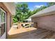 Wide wooden deck features a modern railing, and overlooks a spacious backyard at 604 Clearwater Ct, Mcdonough, GA 30252