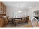 Traditional dining room with wood table, hutch, bench seating and chair seating at 604 Clearwater Ct, Mcdonough, GA 30252