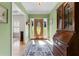 Inviting foyer with hardwood floors and a beautiful wooden cabinet at 604 Clearwater Ct, Mcdonough, GA 30252