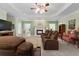 Cozy living room with a fireplace and plenty of seating at 604 Clearwater Ct, Mcdonough, GA 30252
