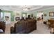 Open-concept living room with fireplace and adjacent dining area at 604 Clearwater Ct, Mcdonough, GA 30252