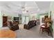 Spacious living room featuring a tray ceiling and comfortable seating at 604 Clearwater Ct, Mcdonough, GA 30252