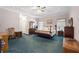 Spacious main bedroom with tray ceilings, ceiling fan, and ensuite bathroom at 604 Clearwater Ct, Mcdonough, GA 30252