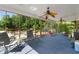 Spacious screened porch with ceiling fans and views of the surrounding trees at 604 Clearwater Ct, Mcdonough, GA 30252