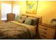 Cozy bedroom with soft natural light, calm yellow walls, and decorative accents at 6265 Lake Windsor Pkwy, Buford, GA 30518