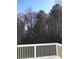 View from the deck of beautiful mature flowering trees against a bright blue sky at 6265 Lake Windsor Pkwy, Buford, GA 30518
