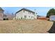 Wide backyard of a two-story home, featuring a spacious, grassy area at 4316 Constellation Blvd, Snellville, GA 30039