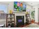 Bright living room featuring a fireplace, large TV, and modern shelving units at 4316 Constellation Blvd, Snellville, GA 30039