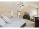 Relaxing main bedroom with high ceilings, ceiling fan, TV, and plush carpeting at 4316 Constellation Blvd, Snellville, GA 30039
