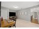 Comfortable bedroom with neutral walls, desk, television and stairway, offering a bright and airy space at 44 Kingsford Xing, Acworth, GA 30101