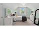 Pretty bedroom featuring a lovely color scheme, comfortable bed, vanity, and a bright window view at 44 Kingsford Xing, Acworth, GA 30101