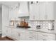 Modern kitchen with custom cabinetry, marble countertops, and gas range for gourmet cooking at 44 Kingsford Xing, Acworth, GA 30101