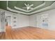Bright bedroom featuring trey ceiling, hardwood floors and access to a stunning ensuite bathroom at 8160 Stone Hill Rd, Cumming, GA 30028