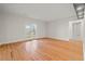 Spacious living room with hardwood floors and natural light from French doors to the backyard at 8160 Stone Hill Rd, Cumming, GA 30028