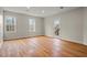 Sun-filled room with hardwood flooring, light walls, and access to outdoor staircase at 8160 Stone Hill Rd, Cumming, GA 30028