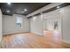 Bright living room featuring hardwood floors, recessed lighting, and black accent ceiling at 8160 Stone Hill Rd, Cumming, GA 30028