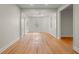 Bright, open living room featuring hardwood floors and natural light with modern trim at 8160 Stone Hill Rd, Cumming, GA 30028