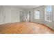 Large living room with hardwood floors, neutral colors, and lots of natural light at 8160 Stone Hill Rd, Cumming, GA 30028