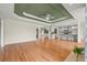 Open-concept living area with hardwood floors, recessed lights, and views into the kitchen at 8160 Stone Hill Rd, Cumming, GA 30028