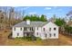 Well-maintained home featuring a rear deck, offering outdoor living and entertaining space at 8160 Stone Hill Rd, Cumming, GA 30028