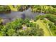 Picturesque aerial shot of a home by the lake, surrounded by verdant trees and serene waterfront scenery at 312 Flat Shoals Church Rd, Stockbridge, GA 30281