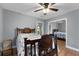 Cozy bedroom with ceiling fan, closet, and hardwood floors at 312 Flat Shoals Church Rd, Stockbridge, GA 30281
