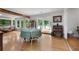 Bright dining room with hardwood floors, large windows, and lake views at 312 Flat Shoals Church Rd, Stockbridge, GA 30281