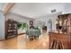 Dining room with wood floors featuring a window view and antique cabinet at 312 Flat Shoals Church Rd, Stockbridge, GA 30281