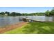 Scenic view of a private dock extending into a calm lake, perfect for waterfront enjoyment at 312 Flat Shoals Church Rd, Stockbridge, GA 30281