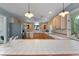 Kitchen with a breakfast bar, tile countertops, and stainless steel appliances at 312 Flat Shoals Church Rd, Stockbridge, GA 30281