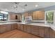 Kitchen with wood cabinets, tile countertops and view of the backyard at 312 Flat Shoals Church Rd, Stockbridge, GA 30281