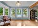 Cozy living room with large windows, lake views, and hardwood floors at 312 Flat Shoals Church Rd, Stockbridge, GA 30281