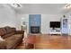 Inviting living room with hardwood floors, fireplace, and lots of natural light at 312 Flat Shoals Church Rd, Stockbridge, GA 30281
