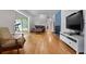 Bright living room featuring hardwood floors and a cozy fireplace at 312 Flat Shoals Church Rd, Stockbridge, GA 30281